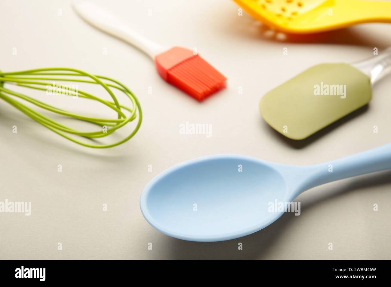 different kitchenware on a grey background top view. Cooking appliances ...