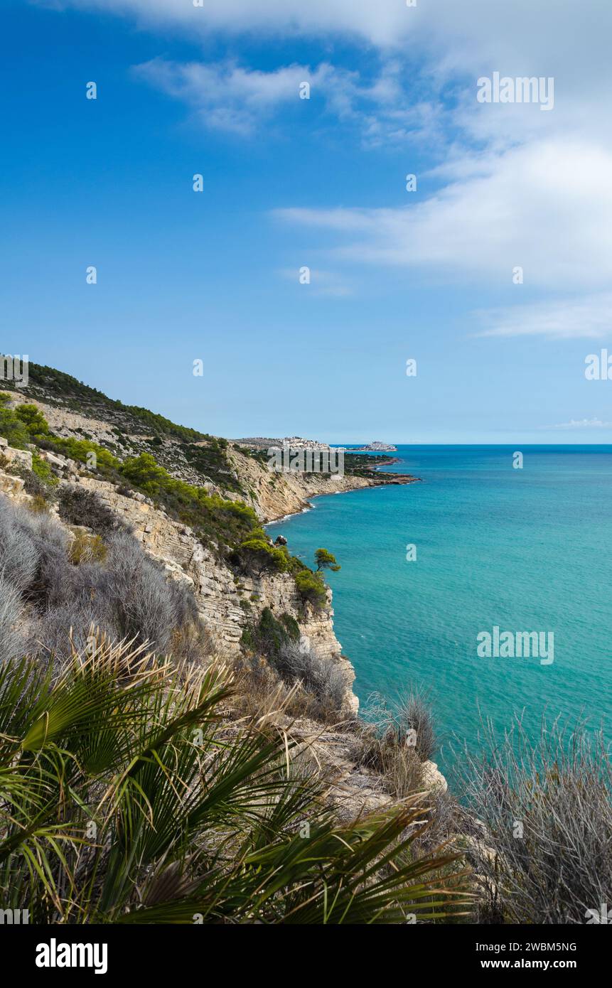 Natural landscape of Sierra de Irta with the medieval village of Peniscola in th background on a day with blue sky, Castellon, Spain Stock Photo