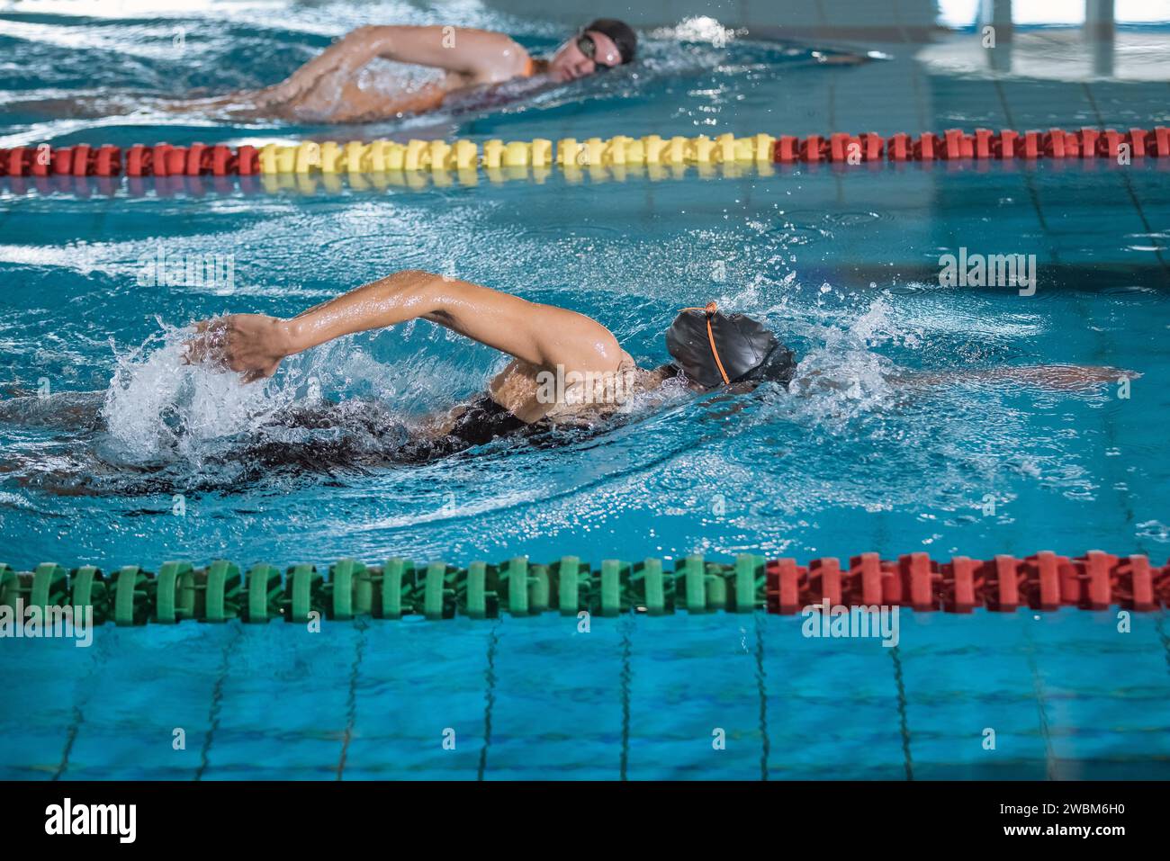 Two female swimmers during a race in the freestyle swim discipline ...