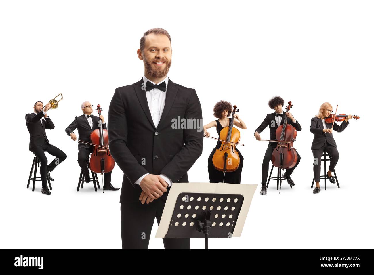 Conductor posing in front of a philharmonic orchestra isolated on white background Stock Photo