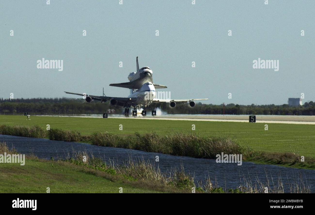 KENNEDY SPACE CENTER, FLA. -- The Shuttle Carrier Aircraft, carrying the orbiter Columbia on its back, kicks up dust as it touches down on runway 33 at KSC’s Shuttle Landing Facility. Columbia began a protracted trip from California on March 1. Unfavorable weather conditions kept it on the ground at Dyess AFB, Texas, until it could return to Florida on March 5 when it landed at the Cape Canaveral Air Force Station Skid Strip. Columbia had to wait for the orbiter Atlantis which had completed a ferry flight to KSC on March 5 to be towed from the SLF before making the final hop to KSC. Columbia i Stock Photo