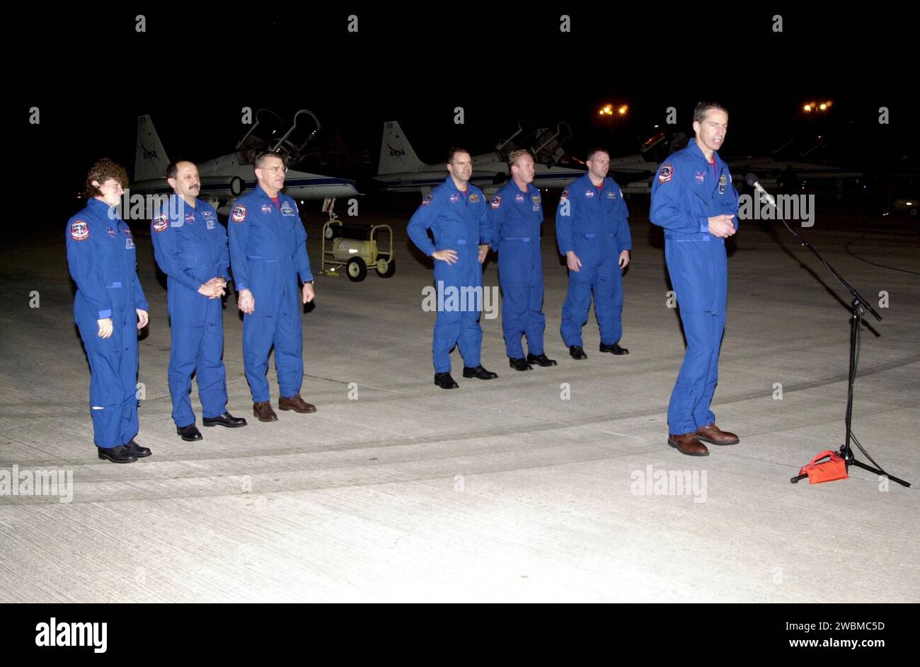 After landing at KSC’s Shuttle Landing Facility, the STS-102 crew pause to brief the media. At the microphone is Commander James Wetherbee. Standing behind him (left to right) are Missions Specialists Susan Helms, Yury Usachev and James Voss, who are also the Expedition Two crew due to replace Expedition One on the International Space Station; Mission Specialists Paul Richards and Andrew Thomas; and Pilot James Kelly. STS-102 will be carrying the Multi-Purpose Logistics Module Leonardo, the primary delivery system used to resupply and return Station cargo requiring a pressurized environment. L Stock Photo