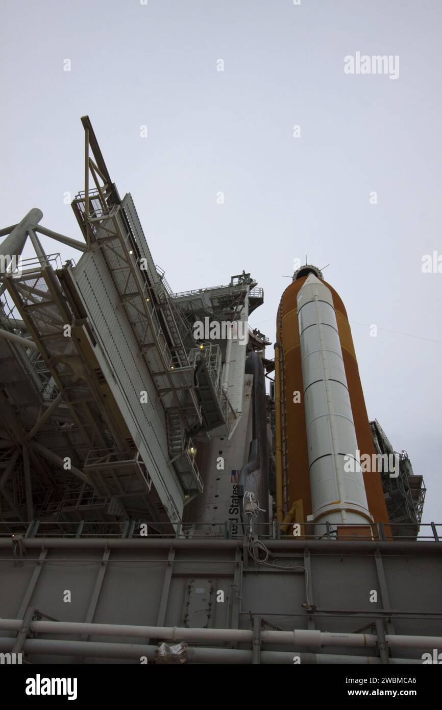 The rotating service structure rolls back on Launch Pad 39A, revealing ...