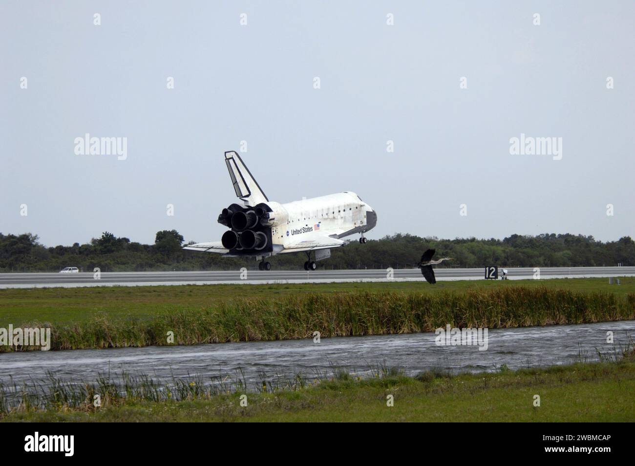 STS119-S-046 (28 March 2009) --- Space Shuttle Discovery touches down on Runway 15 of the Shuttle Landing Facility at NASA's Kennedy Space Center, concluding the 13-day, 5.3-million mile journey of the STS-119 mission to the International Space Station. Onboard are NASA astronauts Lee Archambault, commander; Tony Antonelli, pilot; Steve Swanson, Richard Arnold, Joseph Acaba, John Phillips and Sandra Magnus, all mission specialists. The main landing gear touched down at 3:13:17 p.m. (EDT) on March 28, 2009. The nose gear touched down at 3:13:40 p.m. and wheels stop was at 3:14:45 p.m. During th Stock Photo