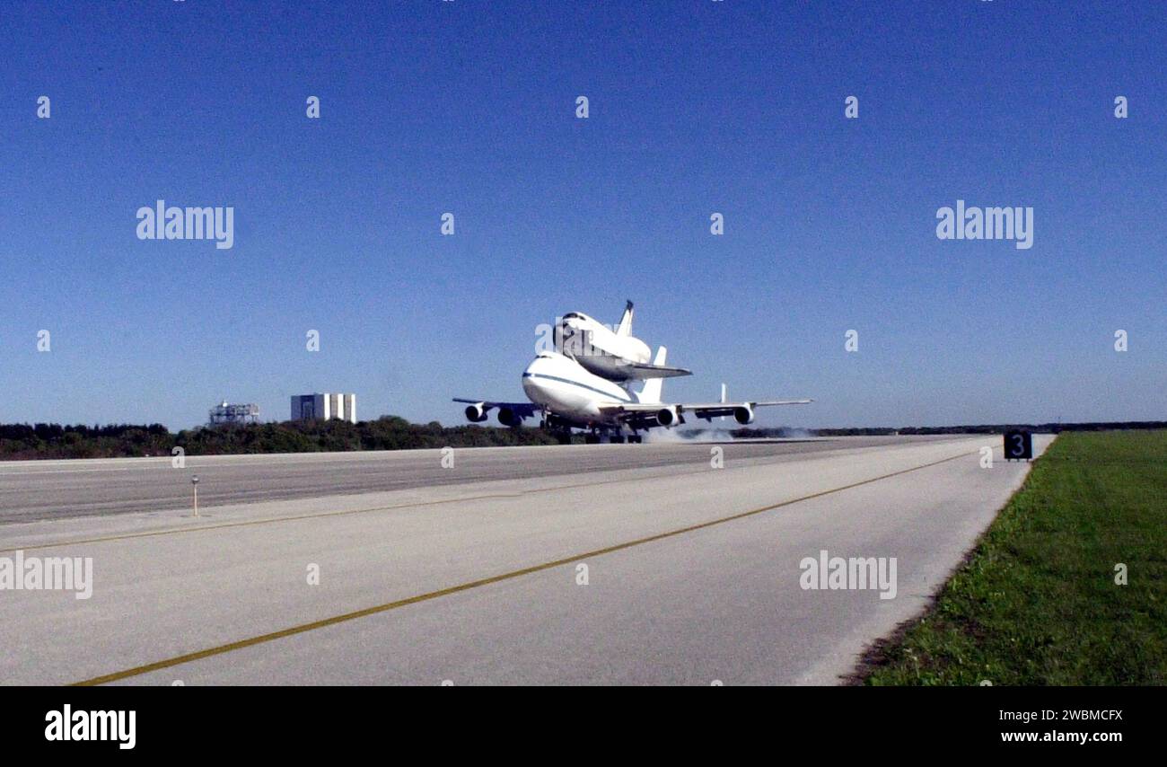 KENNEDY SPACE CENTER, FLA. -- Orbiter Columbia arrives at KSC’s Shuttle Landing Facility atop a Shuttle Carrier Aircraft after a protracted trip from California that began March 1. Unfavorable weather conditions kept it on the ground at Dyess AFB, Texas, until it could return to Florida on March 5 when it landed at the Cape Canaveral Air Force Station Skid Strip. Columbia had to wait for the orbiter Atlantis which had completed a ferry flight to KSC on March 5 to be towed from the SLF before making the final hop to KSC. Columbia is returning from a 17-month-long modification and refurbishment Stock Photo