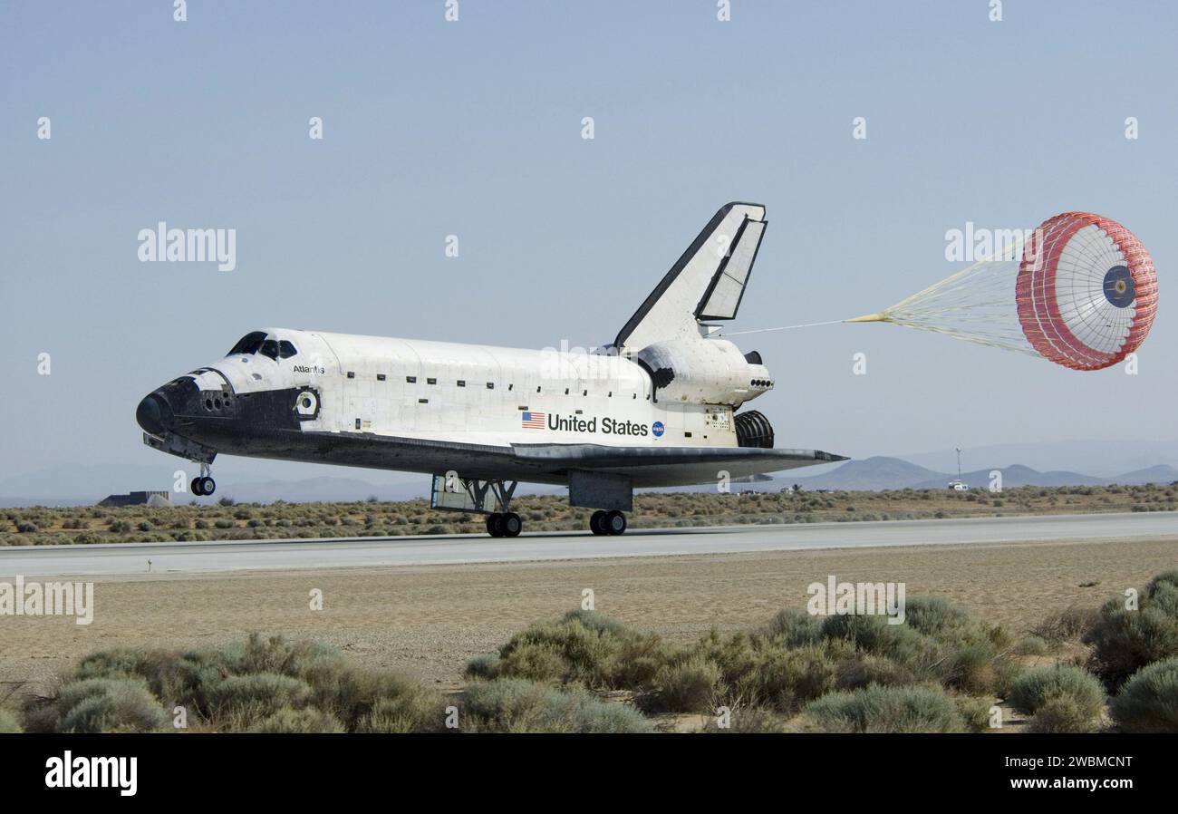 STS125-S-065 (24 May 2009) --- Space Shuttle Atlantis? drag chute is deployed as the spacecraft rolls toward wheels stop on Runway 22 at Edwards Air Force Base in California, ending the STS-125 mission to repair and upgrade NASA?s Hubble Space Telescope. Onboard are astronauts Scott Altman, commander; Gregory C. Johnson, pilot; Michael Good, Megan McArthur, John Grunsfeld, Mike Massimino and Andrew Feustel, all mission specialists. The main landing gear touched down at 8:39:05 a.m. (PDT) on May 24, 2009. Nose gear touchdown was at 8:39:15 a.m. Wheel-stop was at 8:40:15 a.m., bringing the missi Stock Photo