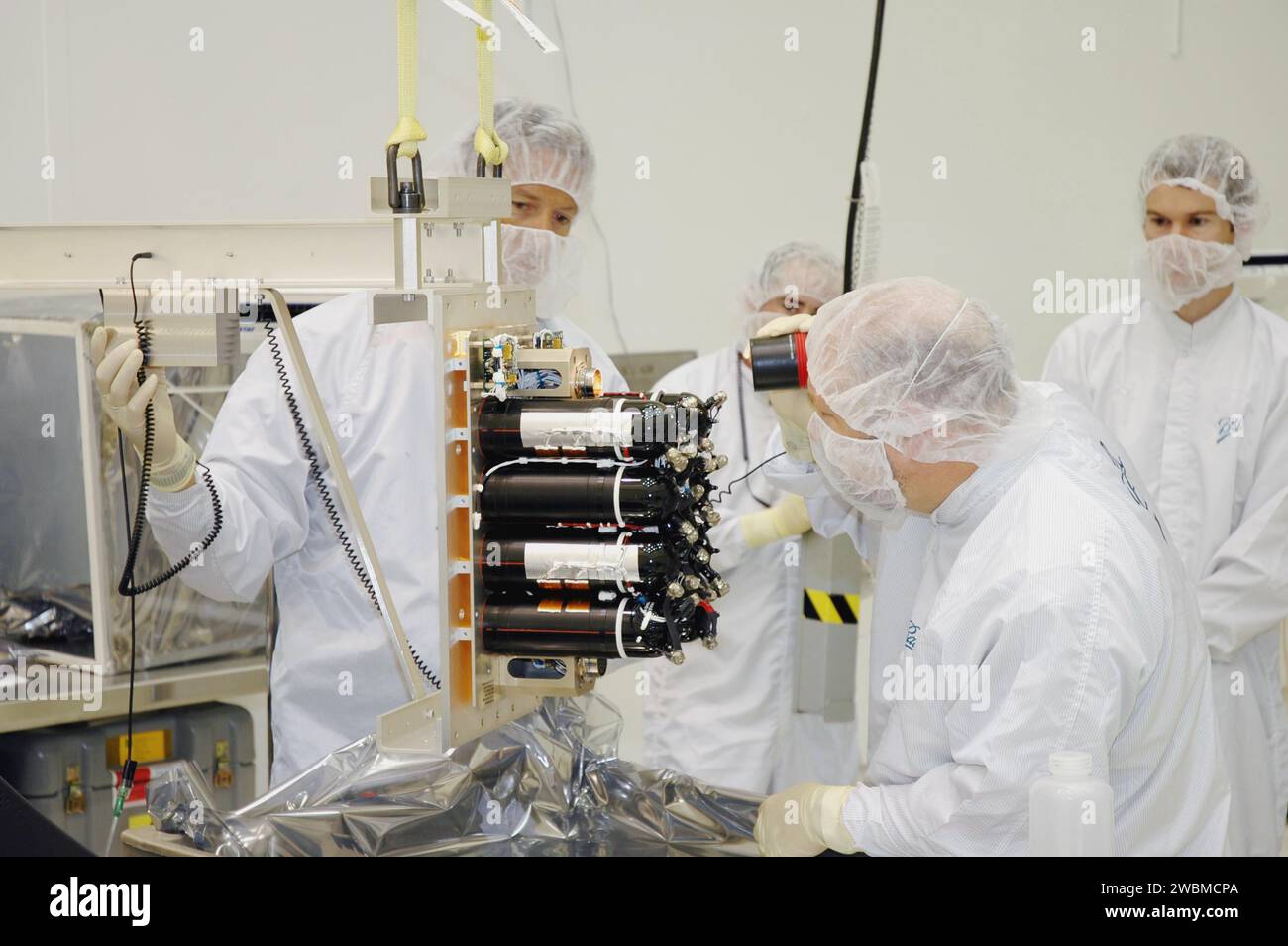 Ball Aerospace technicians inspect the flight battery of the Deep ...