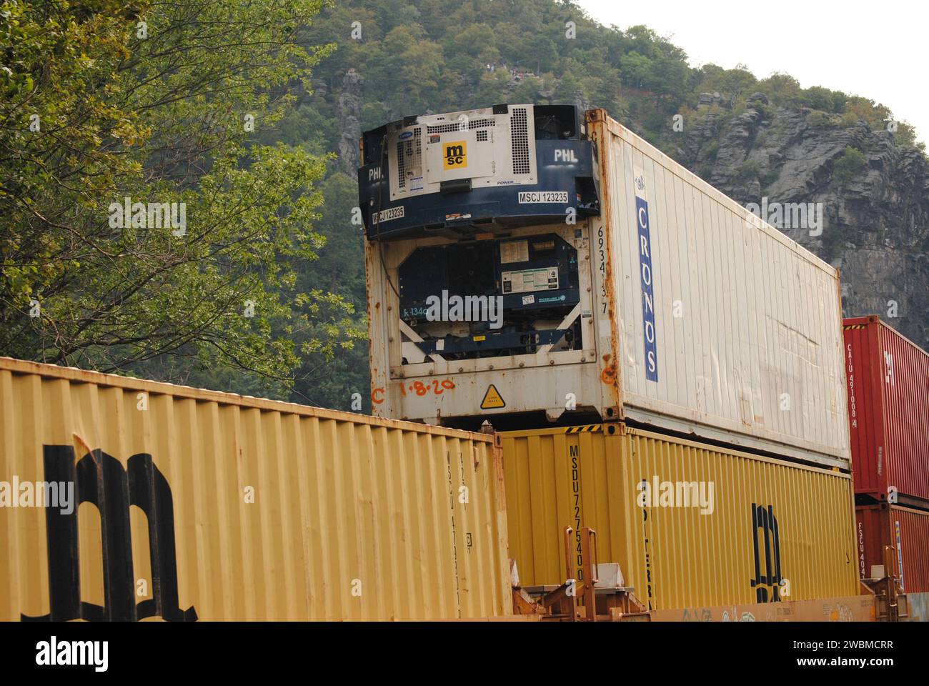 Here is a photo of a double stack intermodal CSX train passing through Harpers Ferry, WV. Stock Photo