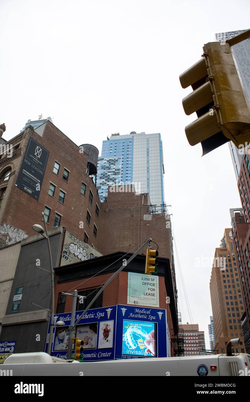 An image of a red and green traffic light located on the corner of a city street Stock Photo Alamy