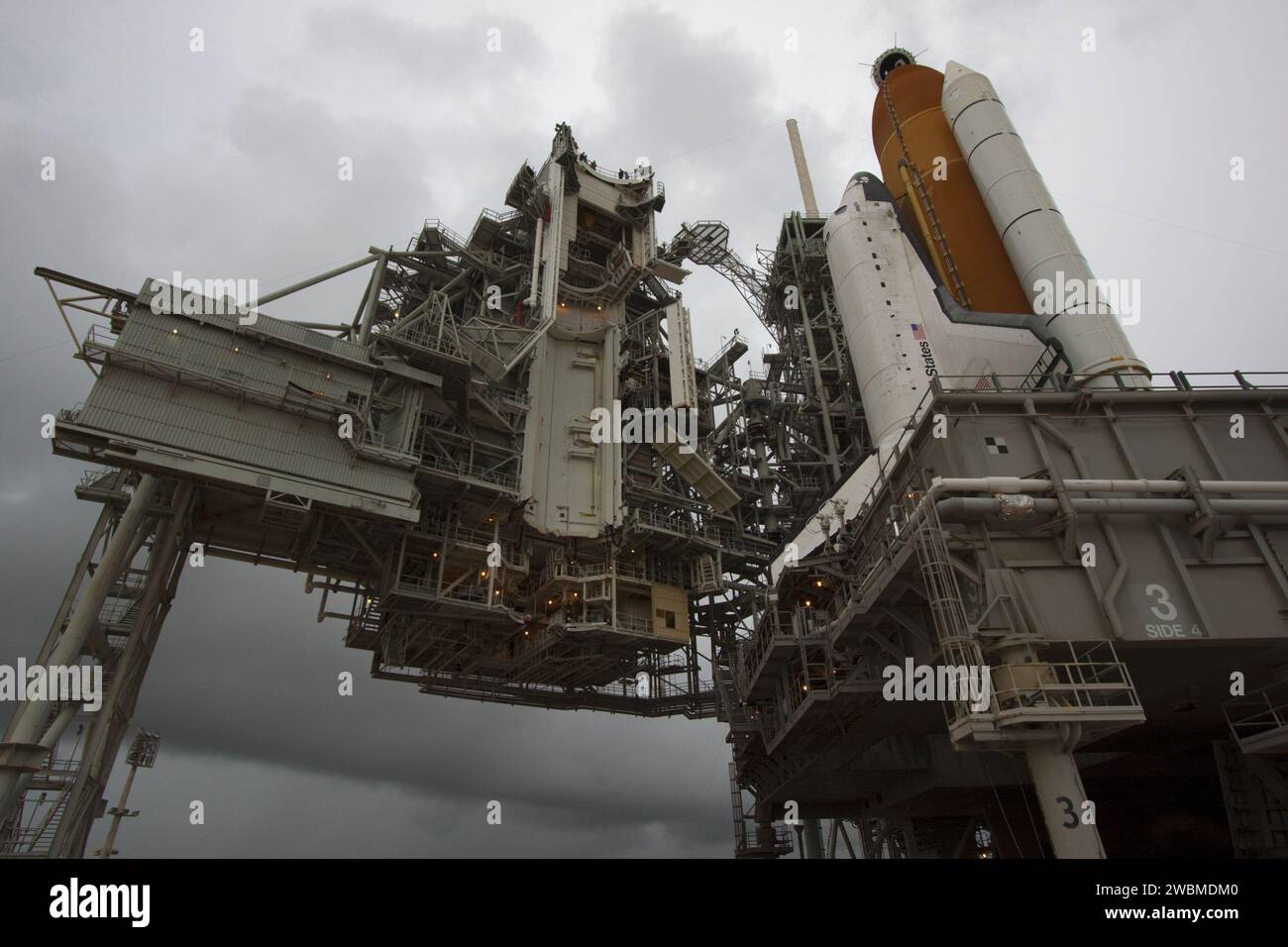 CAPE CANAVERAL, Fla. -- Space shuttle Atlantis is revealed on Launch Pad 39A at NASA's Kennedy Space Center in Florida following the move of the rotating service structure (RSS). The structure provides weather protection and access to the shuttle while it awaits liftoff on the pad. RSS 'rollback' marks a major milestone in Atlantis' STS-135 mission countdown.  Atlantis and its crew of four; Commander Chris Ferguson, Pilot Doug Hurley and Mission Specialists Sandy Magnus and Rex Walheim, are scheduled to lift off at 11:26 a.m. EDT on July 8 to deliver the Raffaello multi-purpose logistics modul Stock Photo