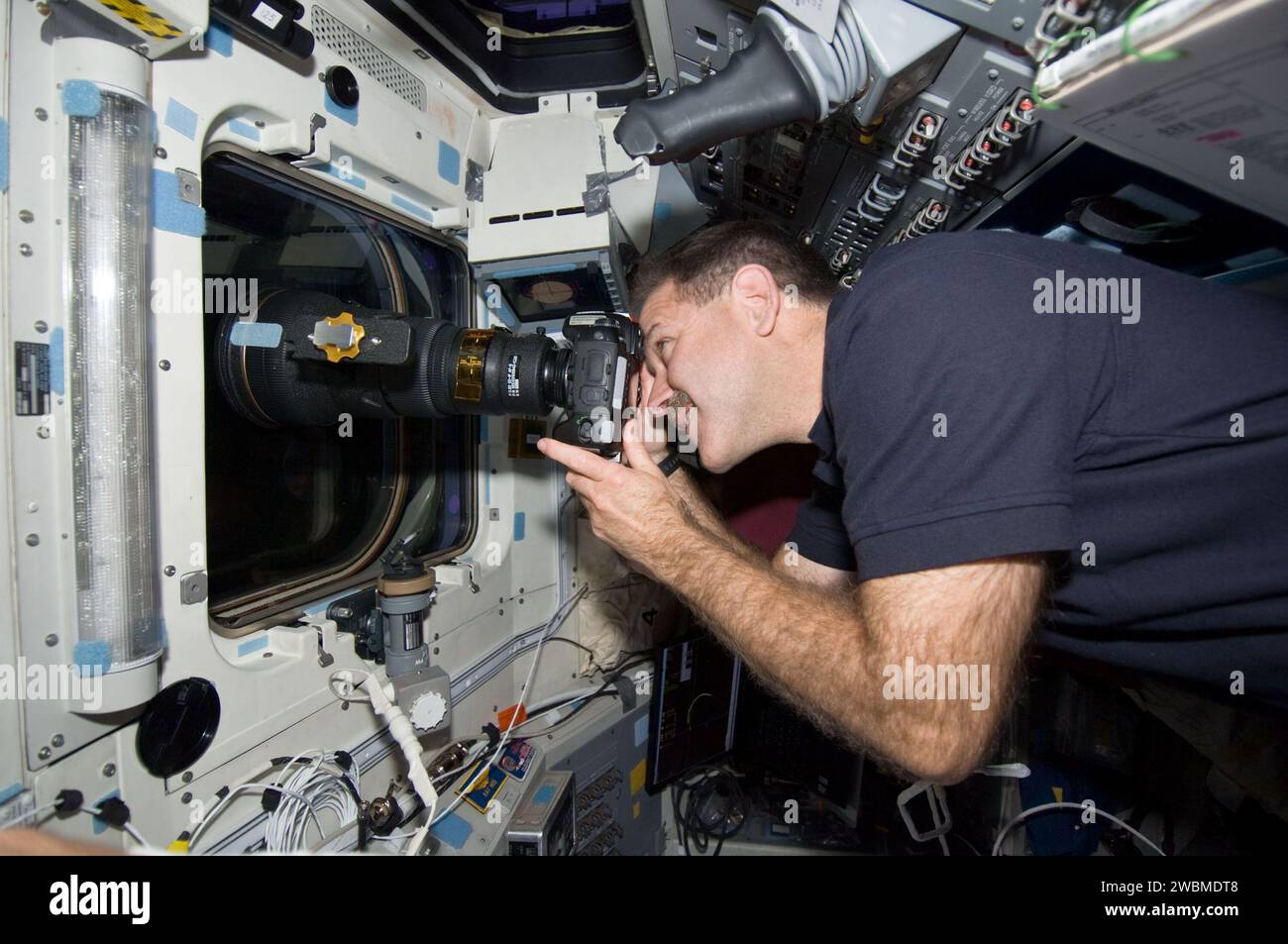 Sts Camera System Astronaut John Grunsfeld of STS-125 used a camera from the aft flight ...