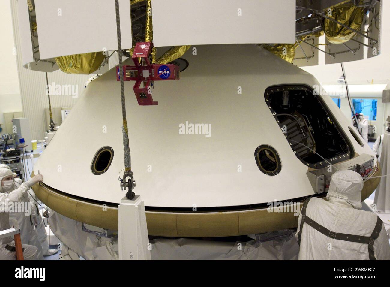 Technicians at Kennedy Space Center lifted the Mars Science Laboratory ...