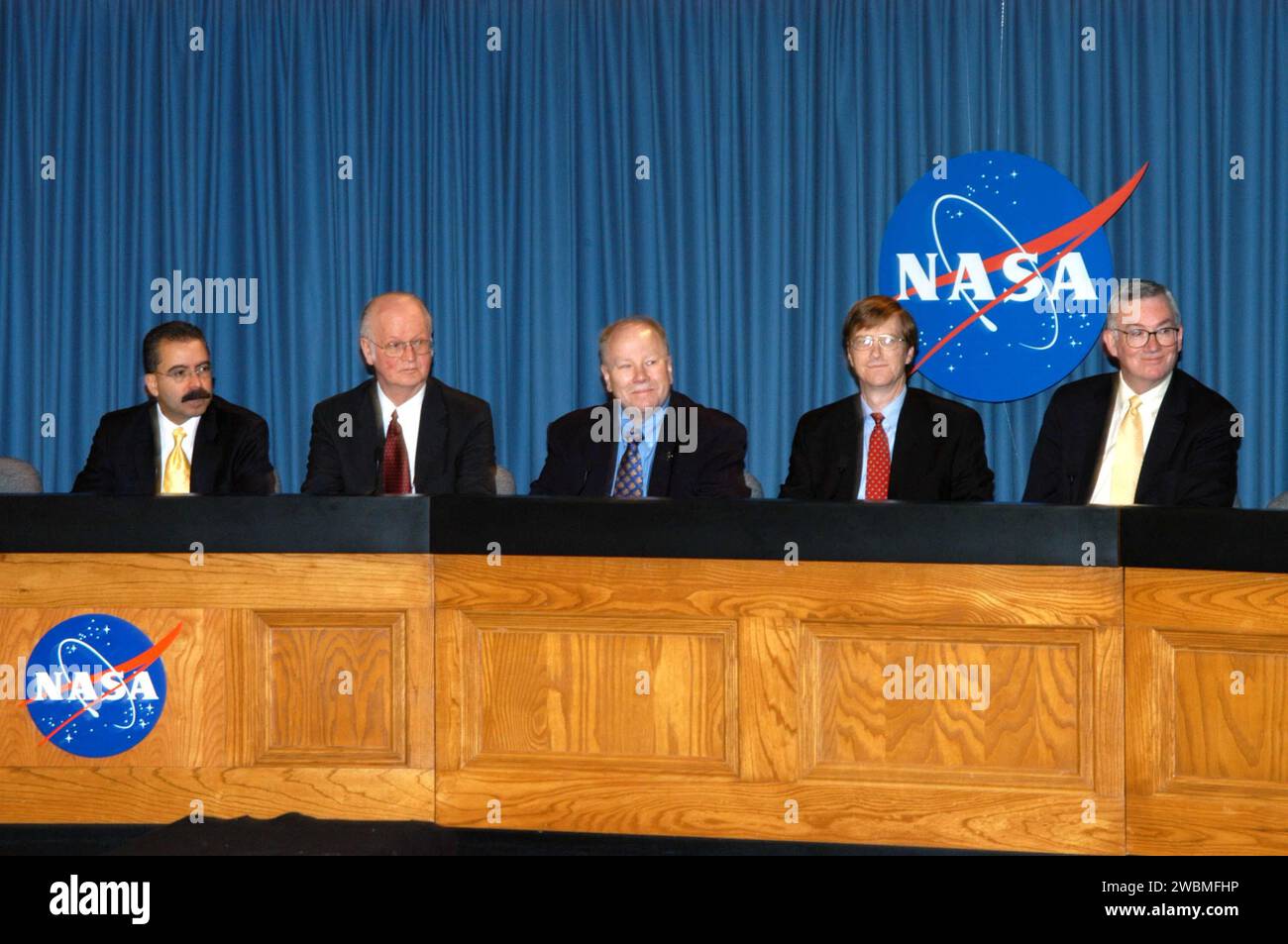KENNEDY SPACE CENTER, FLA. - Representatives of NASA’s New Horizons Mission to Pluto are ready to answer questions during a press briefing on the Draft environmental Impact Statement at NASA’s Kennedy Space Center. From left are Orlando Figueroa, deputy association administrator for Programs, Science Mission Directorate; Earl Wahlquist, associate director for Space and Defense Power Systems, Department of Energy, in Germantown, Md.; Kurt Lindstrom, New Horizons Program executive, with NASA; Hal Weaver, New Horizons Project scientist, Johns Hopkins University Applied Physics Laboratory in Laure Stock Photo