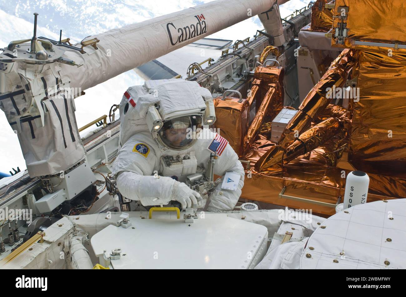 S125-E-008728 (17 May 2009) --- Astronaut Mike Massimino, STS-125 mission specialist, participates in the mission?s fourth session of extravehicular activity (EVA) as work continues to refurbish and upgrade the Hubble Space Telescope. During the eight-hour, two-minute spacewalk, Massimino and astronaut Michael Good (out of frame), mission specialist, continued repairs and improvements to the Space Telescope Imaging Spectrograph (STIS) that will extend the Hubble?s life into the next decade. Stock Photo