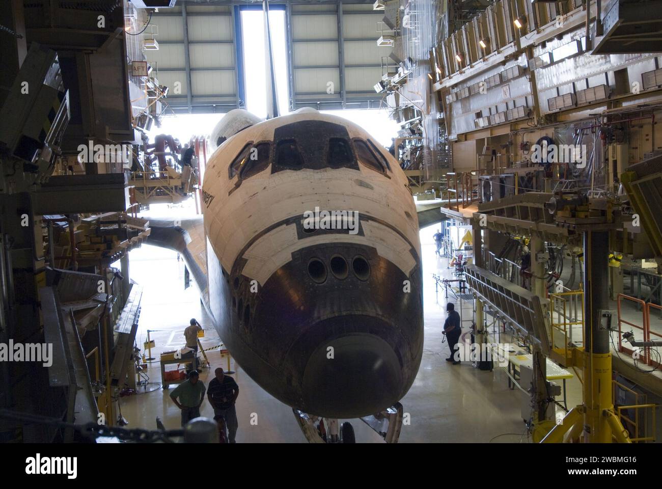 Discovery is positioned in Orbiter Processing Facility-3 at Kennedy ...