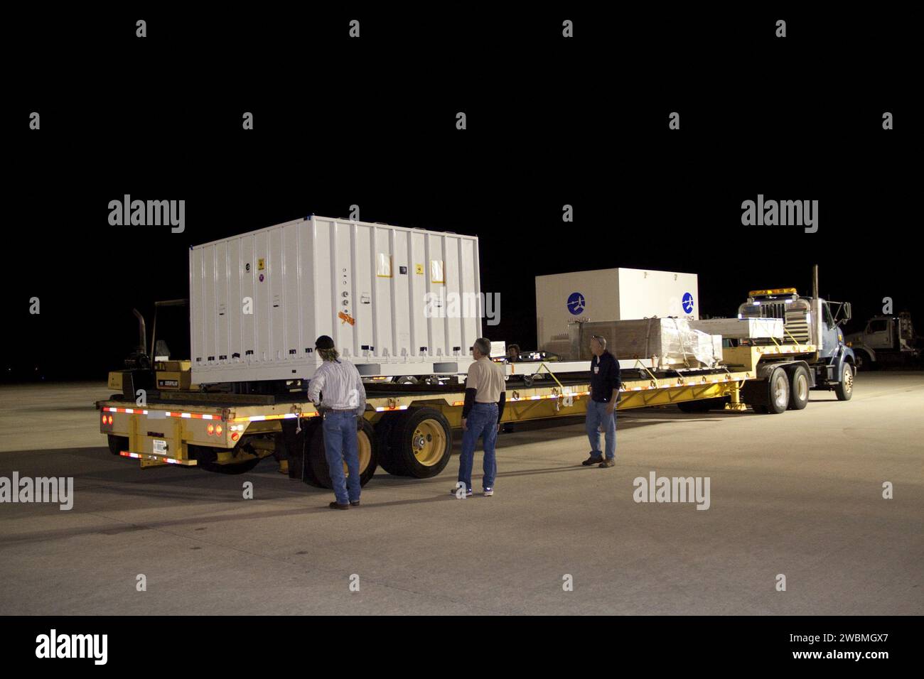 CAPE CANAVERAL, Fla. Workers move the container holding NASA Juno