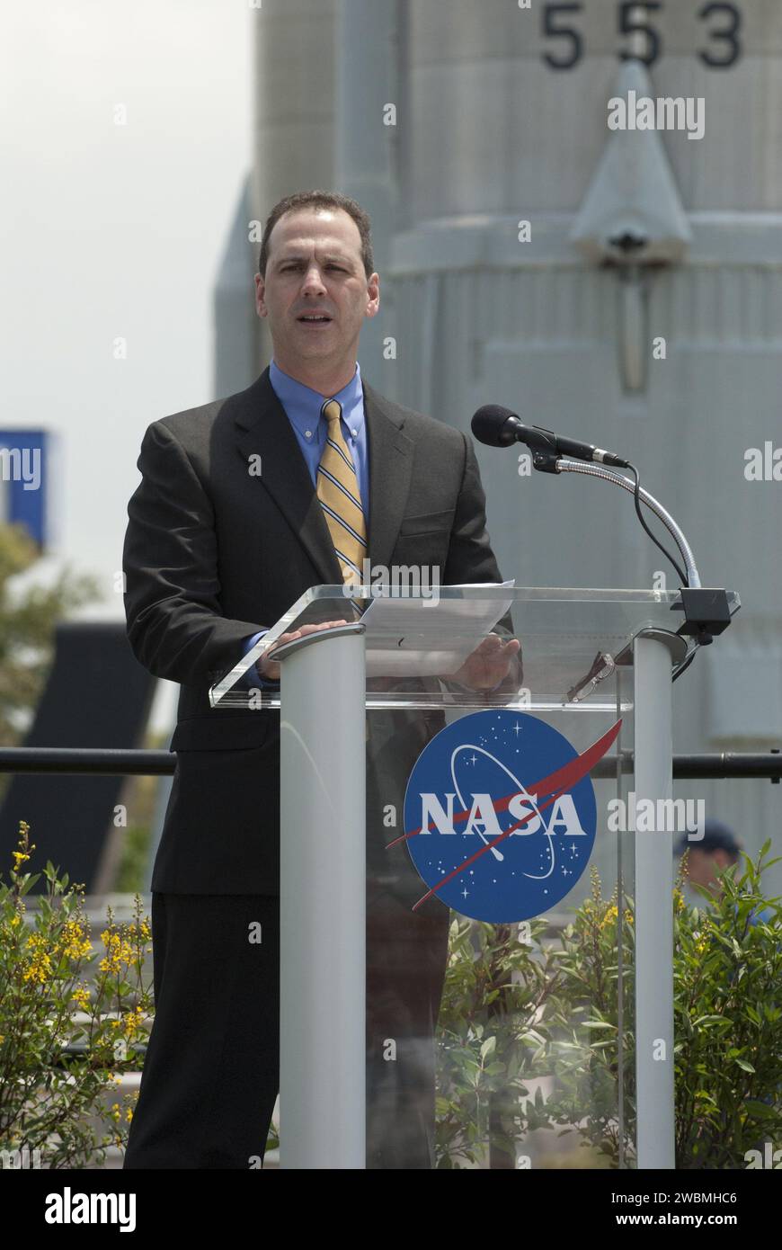 CAPE CANAVERAL, Fla. -- In the Rocket Garden at NASA's Kennedy Space Center Visitor Complex in Florida, United States Postal Service official Steve Massey addresses the audience during an event unveiling two new stamps that commemorate the 50th anniversary of human spaceflight from the United States Postal Service.     One stamp commemorates NASA's Project Mercury and Alan Shepard's historic launch on May 5, 1961, aboard the spacecraft Freedom 7. The second stamp honors NASA's MESSENGER, which reached Mercury in March to become the first spacecraft to orbit the planet. The two missions frame a Stock Photo