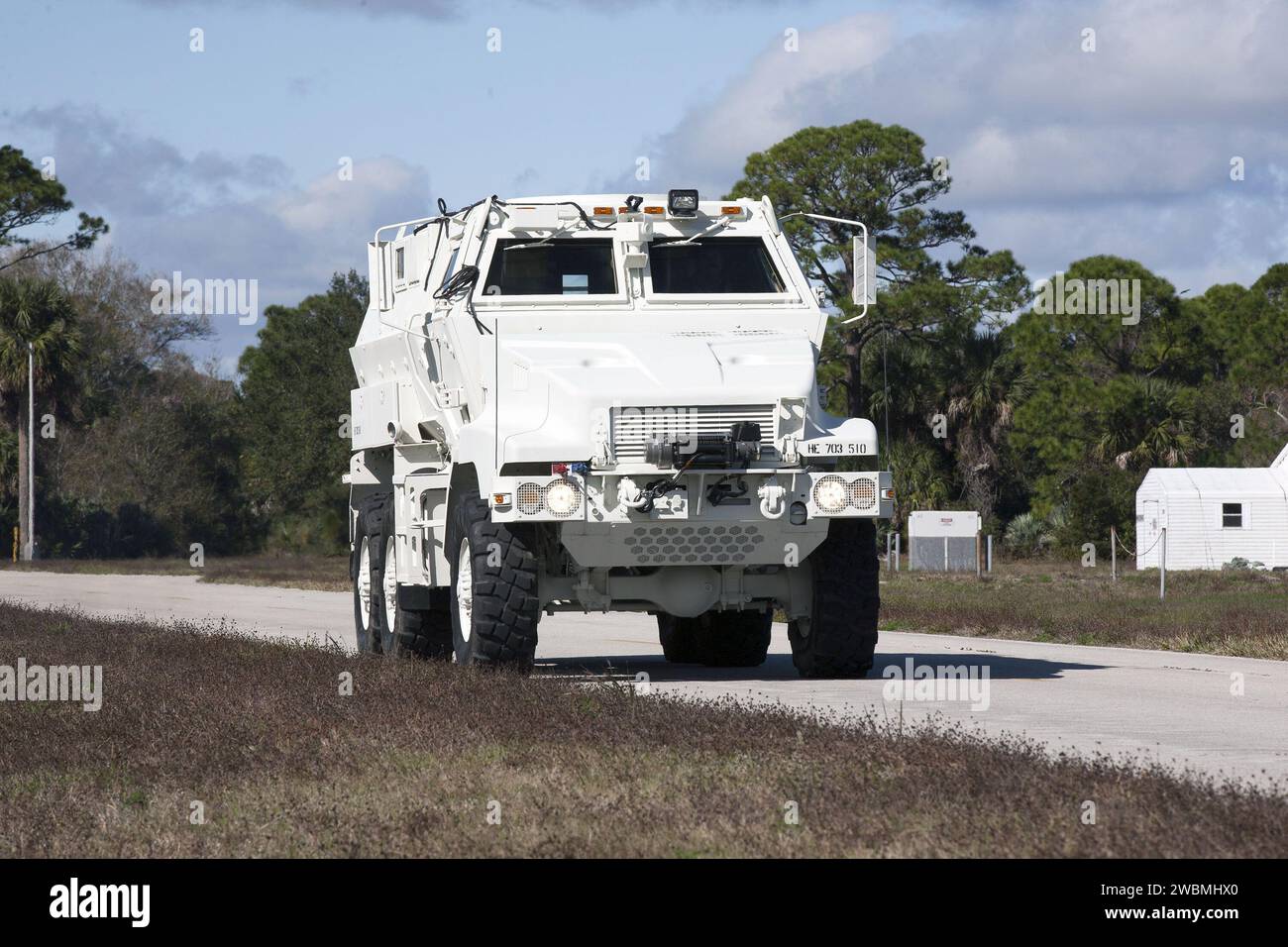 CAPE CANAVERAL, Fla. –One of four new emergency egress vehicles, called Mine-Resistant Ambush-Protection, or MRAP, vehicles is driven to the Maintenance and Operations Facility at NASA’s Kennedy Space Center in Florida. The MRAPs arrived from the U.S. Army Red River Depot in Texarkana, Texas in December 2013. The vehicles were processed in and then transported to the Rotation, Processing and Surge Facility near the Vehicle Assembly Building for temporary storage. The Ground Systems Development and Operations Program at Kennedy led the efforts to an emergency egress vehicle that future astronau Stock Photo