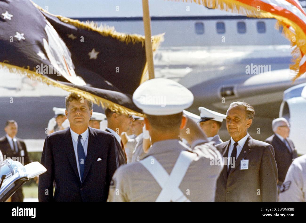 CAPE CANAVERAL, FLA. -- After arrival at Cape Canaveral Missile Test Annex, Skid Strip, President John F. Kennedy left is welcomed by a Color Guard. Dr. Kurt Debus is at right. The President is touring Complex 37, Cape Canaveral Missile Test Annex. Stock Photo
