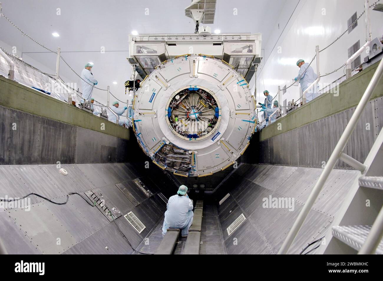 ISS Node 2 is lowered into a payload canister at Kennedy Space Center ...