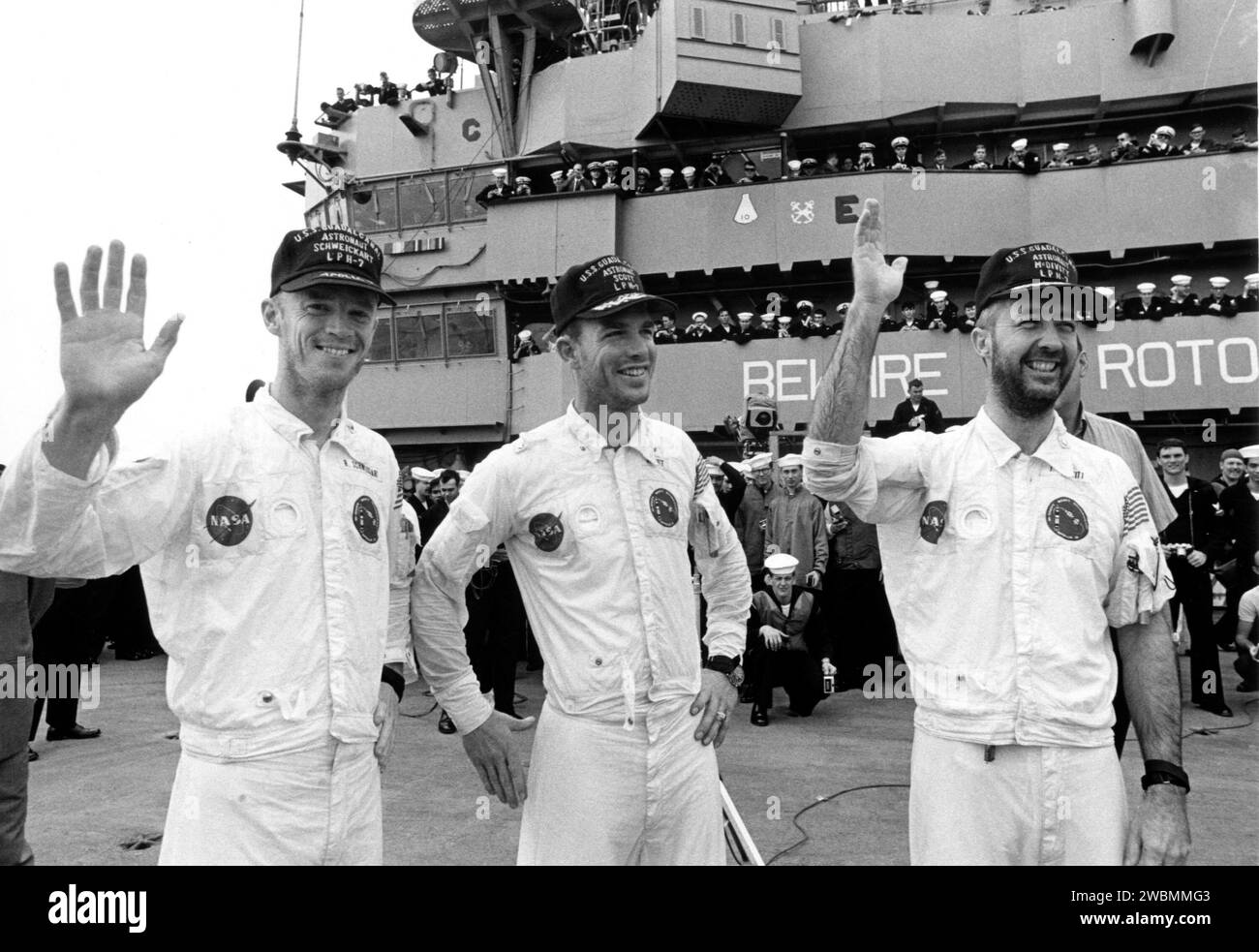 KENNEDY SPACE CENTER, FLA. -- Wearing flight caps presented to them by the crew of the USS Guadalcanal, bearded Apollo 9 astronauts (left to right) Russell L. Schweickart, David R. Scott and James A. McDivitt, wave to well-wishers aboard the recovery ship at the completion of their 10-day Earth orbital mission. Their spacecraft splashed down 780 nautical miles southeast of Cape Kennedy at 12 01 p.m. EST, March 13, 1969. During the textbook mission, the space pilots verified a lunar module spacecraft similar to the one that is to land Americans on the Moon later this year. Their flight began Ma Stock Photo