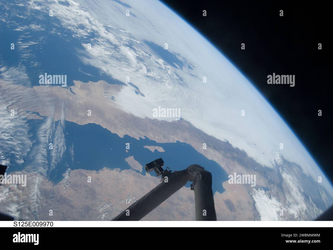 S125-E-009970 (18 May 2009) --- The Gulf of California, Earth?s horizon and a portion of the Space Shuttle Atlantis? remote manipulator system (RMS) are featured in this image photographed during the mission?s fifth and final session of extravehicular activity (EVA). Stock Photo