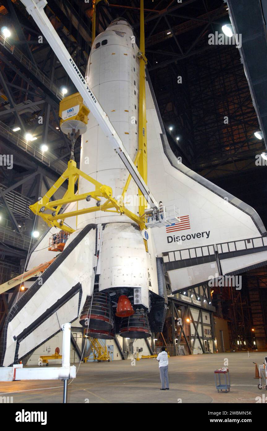 Orbiter Discovery is suspended in the Vehicle Assembly Building ...