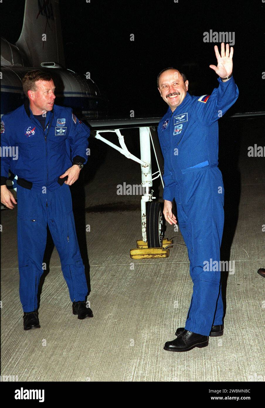 After landing at KSC’s Shuttle Landing Facility, Russian cosmonaut and STS-102 Mission Specialist Yury Usachev (right) waves to the media. Pilot James Kelly (left) is ready to join the other crew members at the microphone. The crew comprises Commander James Wetherbee, Kelly, and Mission Specialists Andrew Thomas, Paul Richards, James Voss, Susan Helms and Usachev. Helms, Usachev and Voss are also the Expedition Two crew replacing Expedition One on the International Space Station. STS-102 will be carrying the Multi-Purpose Logistics Module Leonardo, the primary delivery system used to resupply Stock Photo