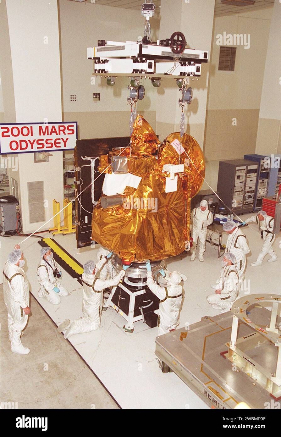 The 2001 Mars Odyssey Orbiter is lowered onto the spin table in the Space Assembly and Encapsulation Building 2. There it will undergo testing. The orbiter carries three science instruments THEMIS, the Gamma Ray Spectrometer (GRS), and the Mars Radiation Environment Experiment (MARIE) that will map the mineralogy and morphology of the Martian surface, the elemental composition of the surface and determine the abundance of hydrogen in the shallow subsurface, and characterize aspects of the near-space radiation environment with regards to the radiation-related risk to human explorers. The Mars O Stock Photo