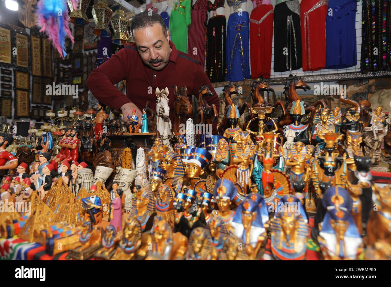 Baghdad, Iraq. 11th Jan, 2024. An exhibitor arranges products during