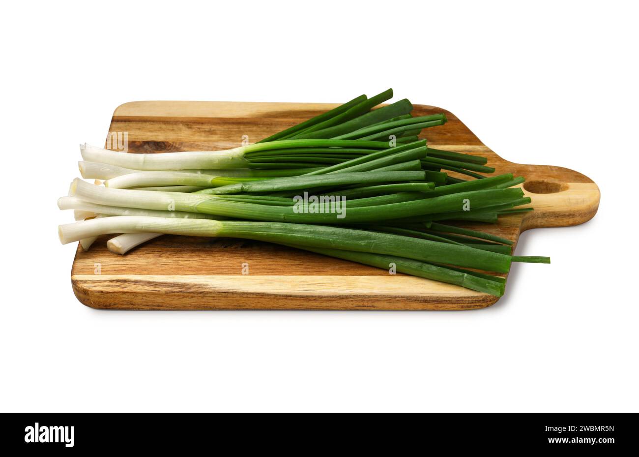 Wooden board with fresh green onion isolated on white background Stock ...