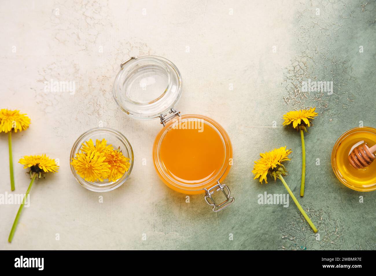 Jar and bowls with dandelion honey on white background Stock Photo - Alamy