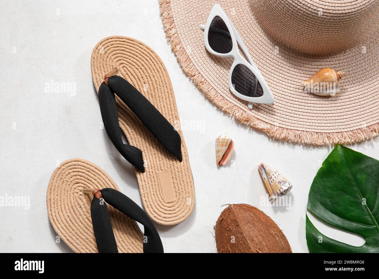 Flip flops with sunglasses and hat on white background Stock Photo - Alamy