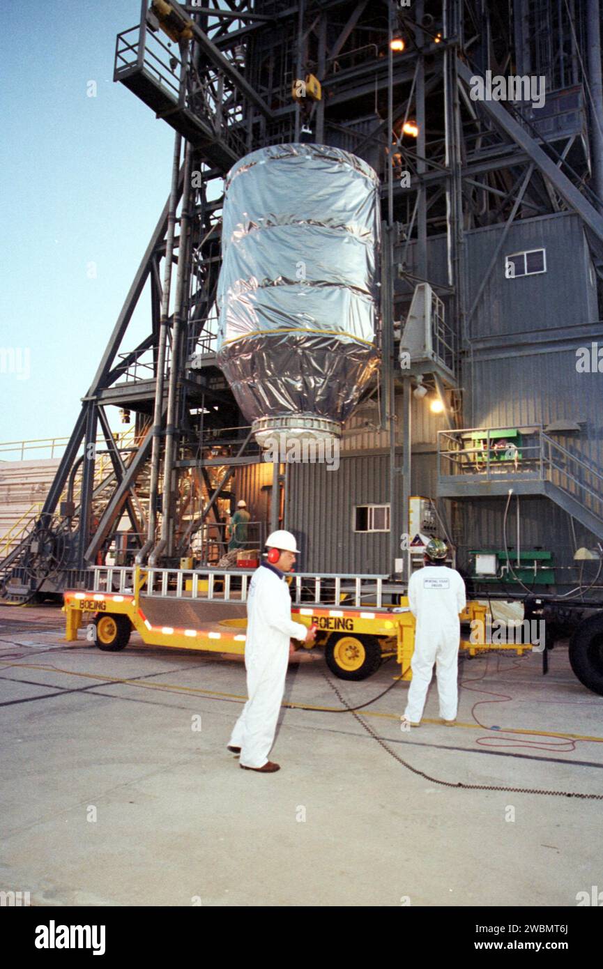 KENNEDY SPACE CENTER, Fla. -- At Launch Complex 17-A, Cape Canaveral Air Force Station, the Genesis spacecraft is lifted off the transporter. Genesis is 7.5 feet (2.3 meters) long and 6.6 feet (2 meters) wide, with a wingspan of solar array 26 feet (7.9 meters) tip to tip. Genesis will be on a robotic NASA space mission to catch a wisp of the raw material of the Sun and return it to Earth with a spectacular mid-air helicopter capture. The sample return capsule is 4.9 feet (1.5 meters) in diameter and 52 inches (1.31 meters) tall. The mission’s goal is to collect and return to Earth just 10 to Stock Photo