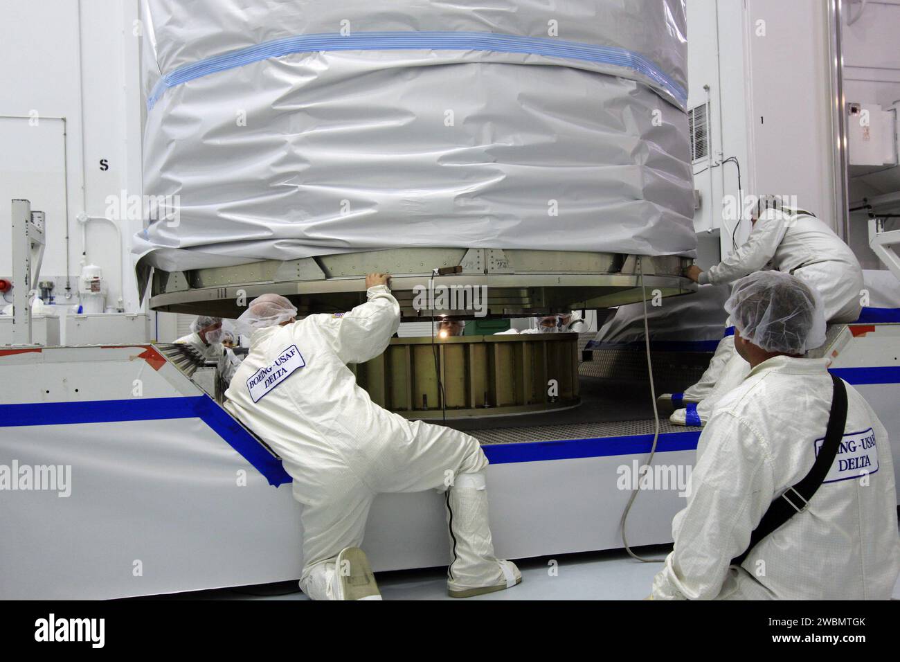 Lockheed Martin technicians at Astrotech Space Operations guide NASA's ...