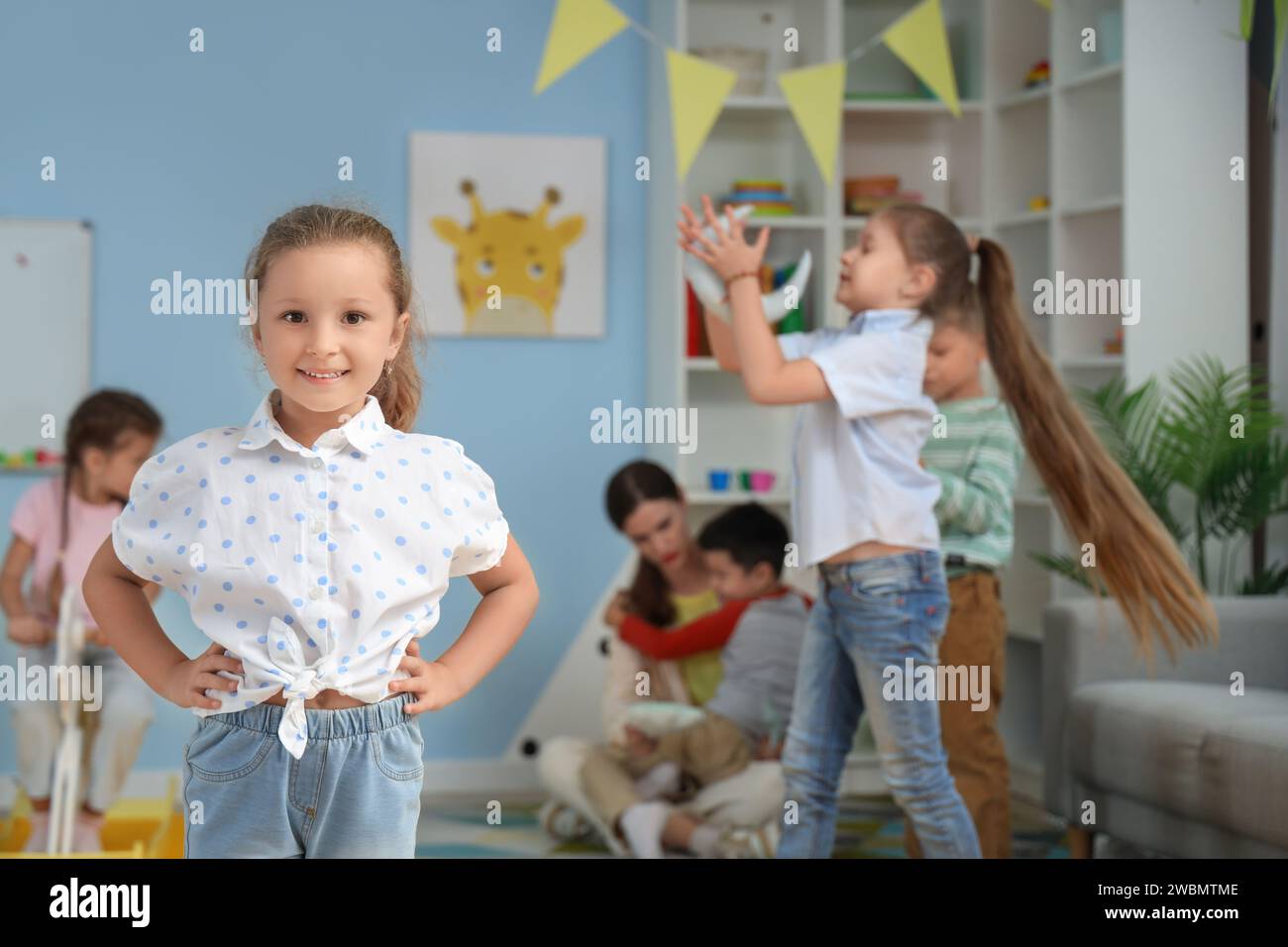 Cute little girl in kindergarten Stock Photo - Alamy
