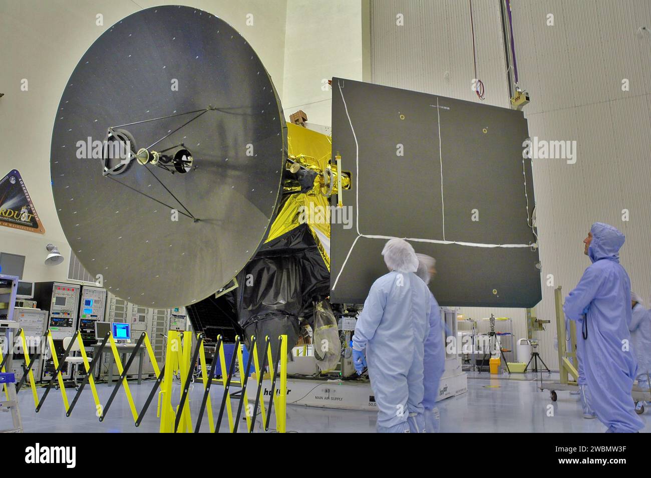 At Kennedy Space Center, Lockheed Martin workers deploy the solar array ...