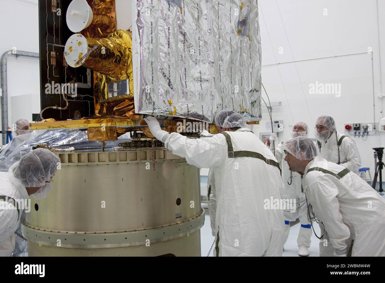 GRAIL-B lunar probe is positioned by Lockheed Martin technicians on the ...