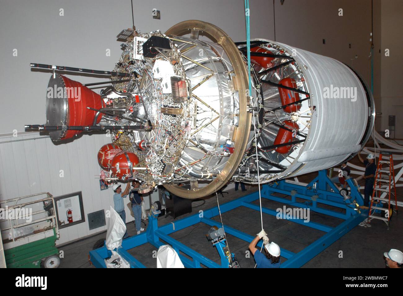 KENNEDY SPACE CENTER, FLA. - At the Boeing Delta Operations Center, the second stage of a Boeing Delta IV launch vehicle is lifted off its transporter for transfer to a work stand. The Delta IV rocket will be used for the 2005 launching of the GOES-N weather satellite for NASA and NOAA (National Oceanic and Atmospheric Administration). The first in a series of three advanced weather satellites including GOES-O and GOES-P, the GOES-N will provide continuous monitoring necessary for intensive data analysis. It will provide a constant vigil for the atmospheric “triggers” of severe weather conditi Stock Photo