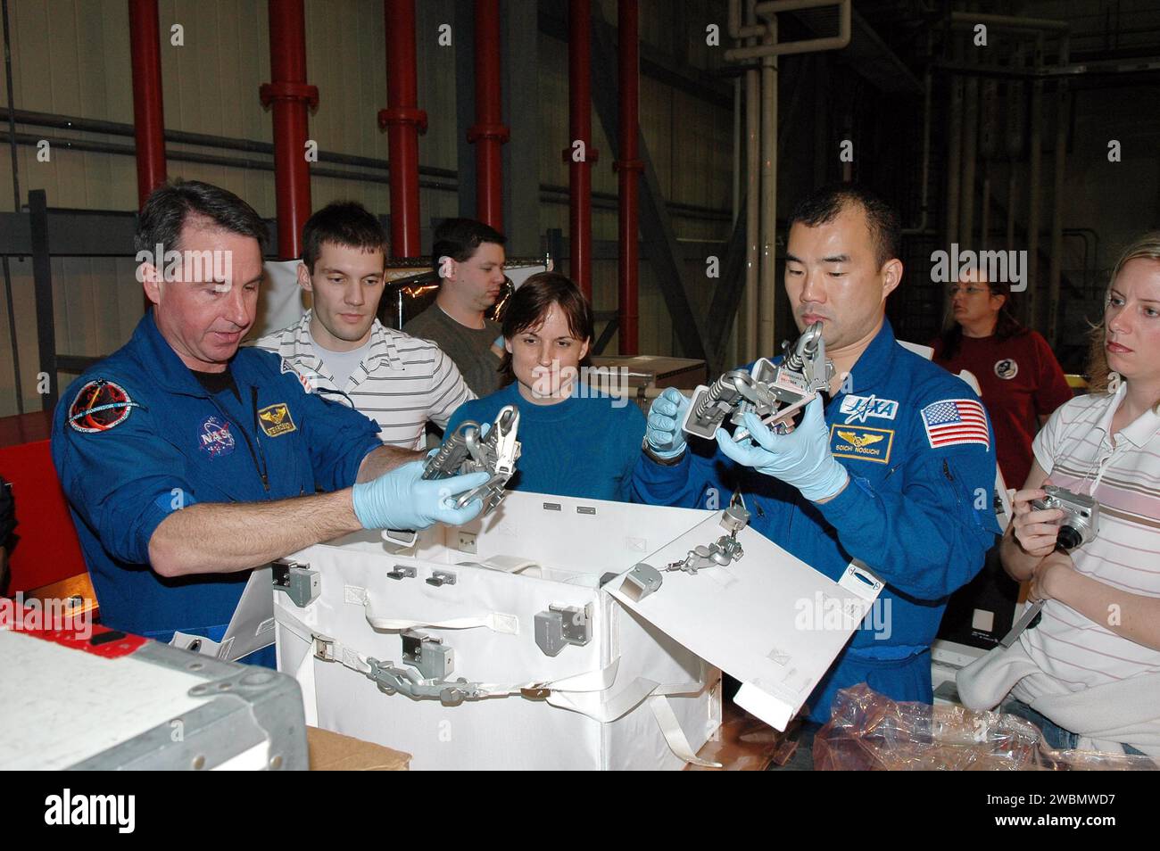 At Kennedy Space Center’s Orbiter Processing Facility, STS-114 crew ...