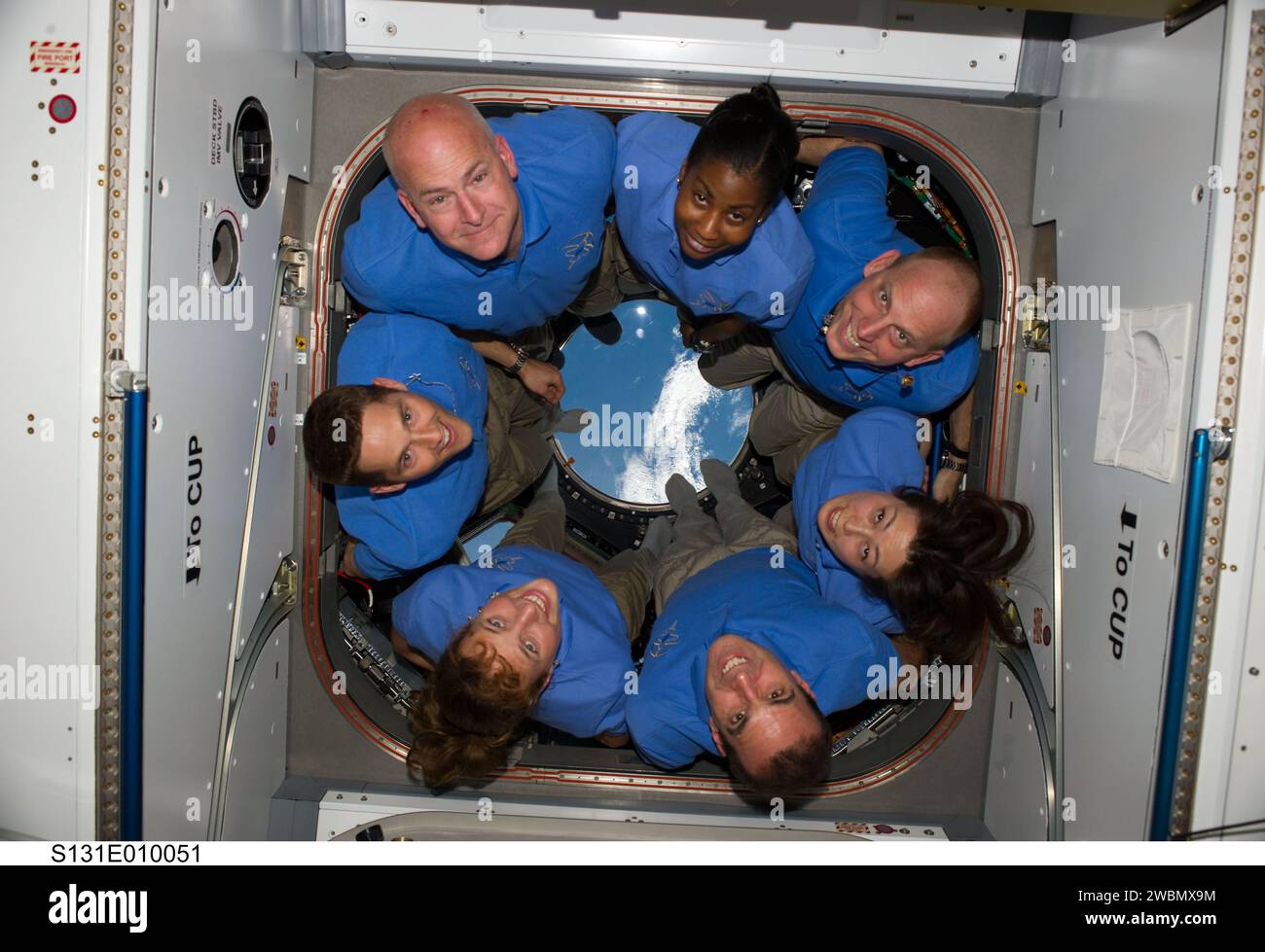 S131-E-010051 (14 April 2010) --- The STS-131 crew members pose for a portrait in the Cupola of the International Space Station while space shuttle Discovery remains docked with the station. Pictured counter-clockwise (from top left) are NASA astronauts Alan Poindexter, commander; James P. Dutton Jr., pilot; Dorothy Metcalf-Lindenburger, Rick Mastracchio, Japan Aerospace Exploration Agency (JAXA) astronaut Naoko Yamazaki, NASA astronauts Clayton Anderson and Stephanie Wilson, all mission specialists. Stock Photo
