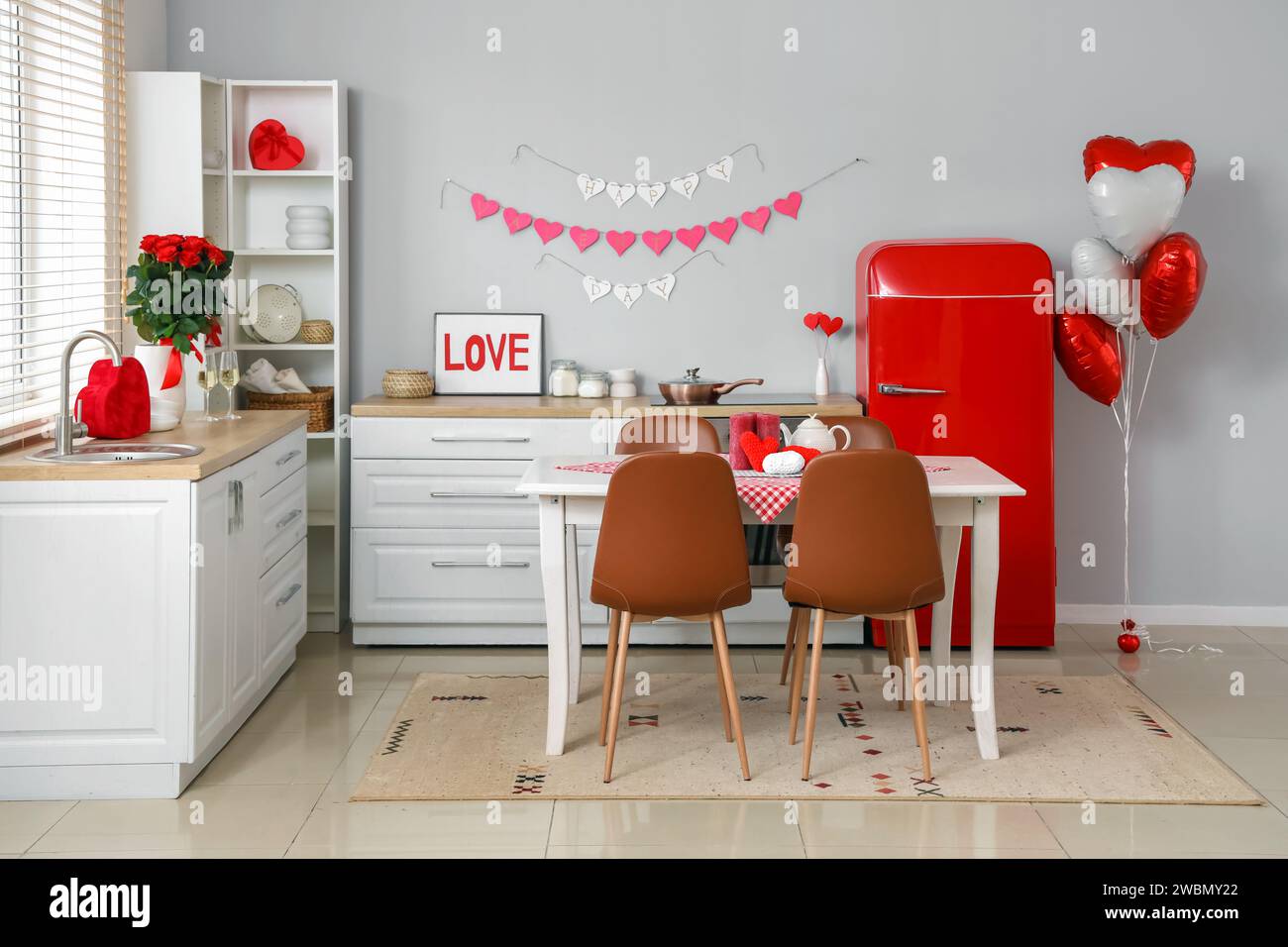 Interior of festive kitchen with decorations for Valentine's Day ...
