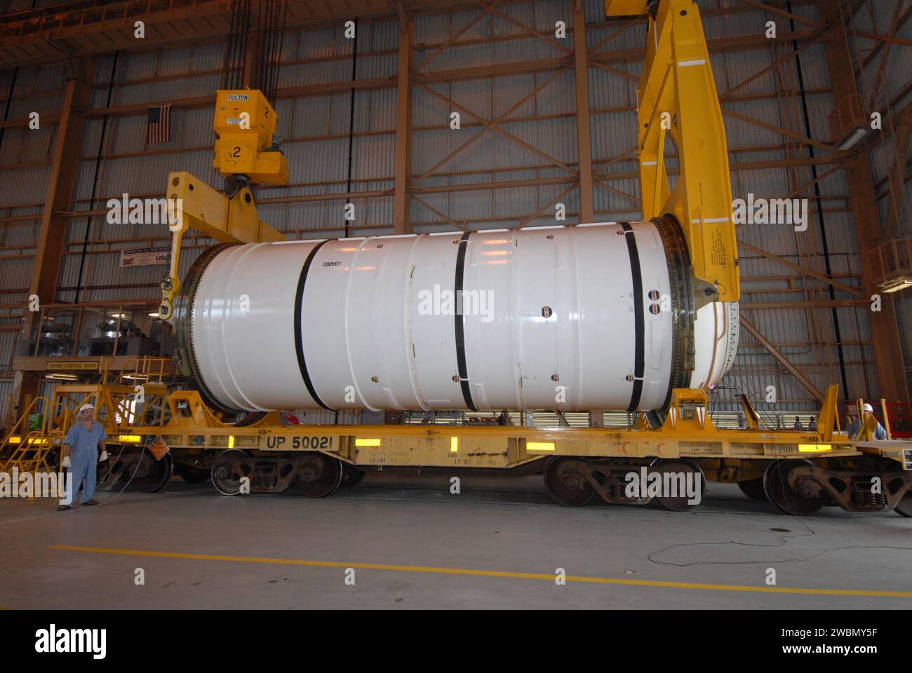 CAPE CANAVERAL, Fla. –  Cranes are attached to the first of the Ares I-X motor segments to raise and transfer it to a work stand in the Rotation, Processing and Surge Facility at NASA's Kennedy Space Center in Florida. Four segments were delivered to Kennedy for final processing and integration. The booster used for the Ares I-X launch is being modified by adding new forward structures and a fifth segment simulator. The motor is the final hardware needed for the rocket's upcoming test flight this summer. The stacking operations are scheduled to begin in the Vehicle Assembly Building in April. Stock Photo