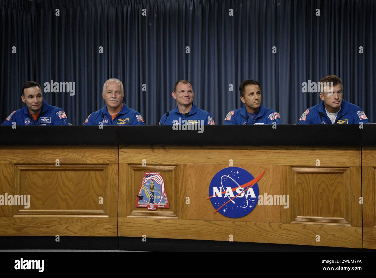 CAPE CANAVERAL, Fla. – At NASA's Kennedy Space Center in Florida, members of the STS-119 crew participate in a news conference following landing of the space shuttle Discovery STS-119 mission to the International Space Station. From left are Commander Lee Archambault, Mission Specialist John Phillips, Pilot Tony Antonelli and Mission Specialists Joseph Acaba and Steve Swanson.  Main gear touchdown was at 3:13:17 p.m. EDT.  Nose gear touchdown was at 3:13:40 p.m. and wheels stop was at 3:14:45 p.m.  Discovery delivered the final pair of large power-generating solar array wings and the S6 truss Stock Photo