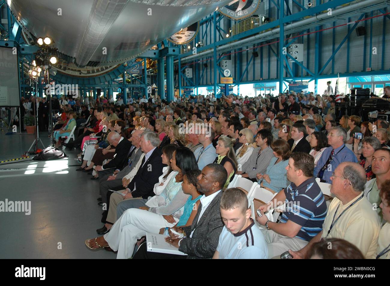 KENNEDY SPACE CENTER, FLA. - A crowd of 1,000 gather in Kennedy Space Center Visitor Complex’s Apollo Saturn V Center for the Astronaut Hall of Fame Induction Ceremony. The event was attended by KSC Director Jim Kennedy and his wife, Bernadette, many previous inductees and invited guests, as well as the media, to honor the newest inductees Bruce McCandless, Joe Allen and Gordon Fullerton. Master of Ceremonies was LeVar Burton, who starred in the television series “Star Trek The Next Generation.” Recognized for their individual flight accomplishments and contributions to the success and future Stock Photo