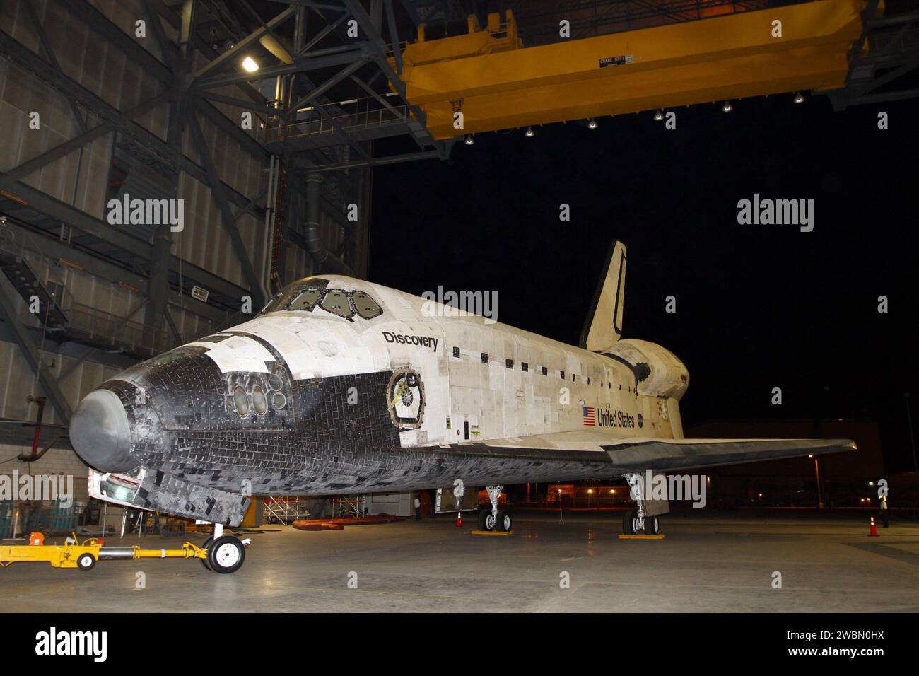 CAPE CANAVERAL, Fla. – Preparations to roll space shuttle Discovery out of the Vehicle Assembly Building, or VAB, to the Shuttle Landing Facility, or SLF, are under way at NASA’s Kennedy Space Center in Florida.   Discovery was in storage in the VAB’s high bay 4 awaiting departure from Kennedy’s Launch Complex 39 area for the final time.  At the SLF, Discovery will be hoisted onto a Shuttle Carrier Aircraft, or SCA, with the aid of a mate-demate device.  The SCA, a modified Boeing 747 jet airliner, is scheduled to transport Discovery to the Washington Dulles International Airport in Virginia o Stock Photo