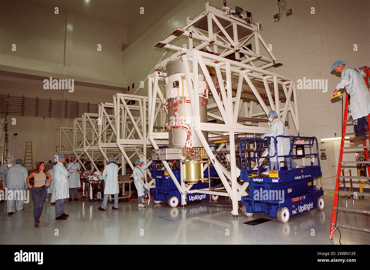 Overhead Array Workers in the Space Station Processing Facility prepare to attach an ...