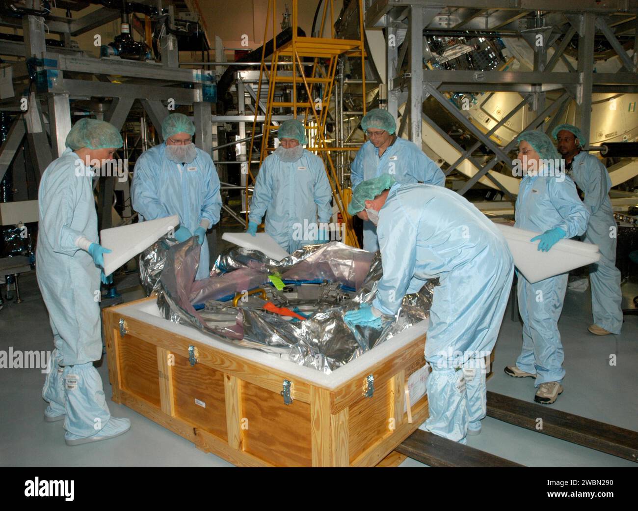 At Kennedy Space Center’s Space Station Processing Facility, workers ...