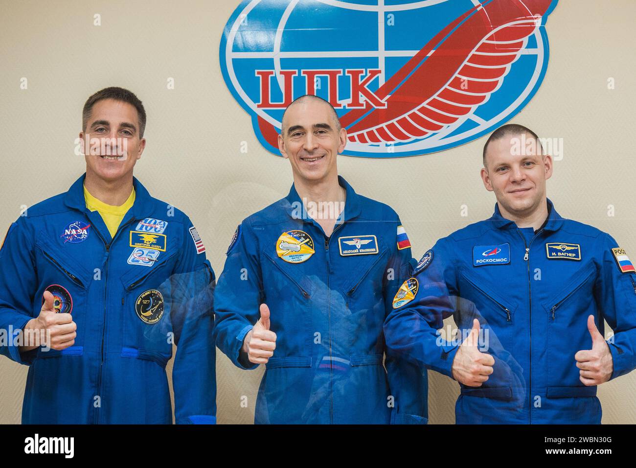 jsc2020e017048 - At the Cosmonaut Hotel crew quarters in Baikonur, Kazakhstan, Expedition 63 crewmembers Chris Cassidy of NASA (left) and Anatoly Ivanishin (center) and Ivan Vagner (right) of Roscosmos pose for pictures April 8 as they prepare for launch. They will launch April 9 on the Soyuz MS-16 spacecraft from the Baikonur Cosmodrome for a six-and-a-half month mission on the International Space Station...Andrey Shelepin/Gagarin Cosmonaut Training Center. Stock Photo