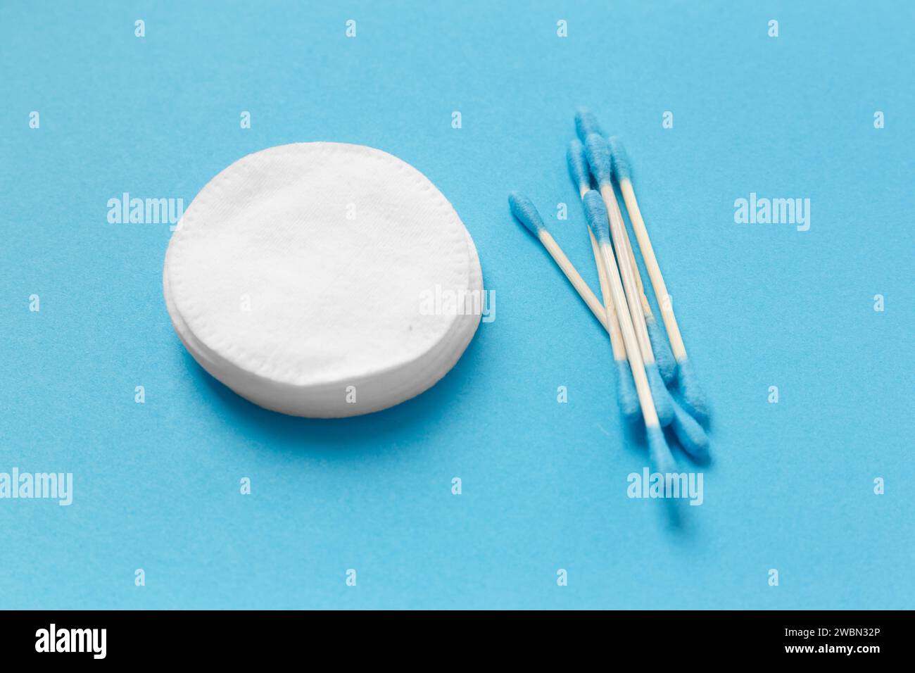 Composition from cotton swabs buds and cotton pads on a white